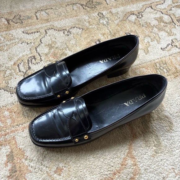 Prada Women's Elegant Black Loafers with Gold Accents - Picture 2 of 3